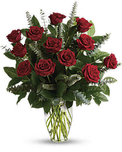 One dozen royal roses red accented with eucalyptus beautiful foliage in clear glass vase in Washington DC and Rockville MD, Palace Florists